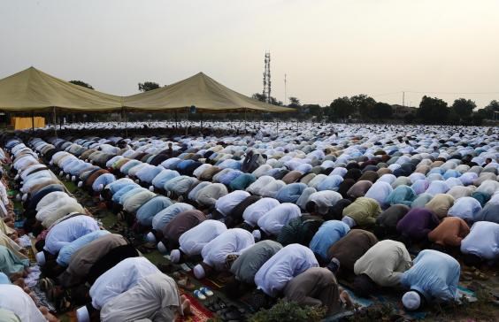 Pakistani residents offer Eid al-Fitr prayers on the outskirts of Peshawar AFP/Getty Images